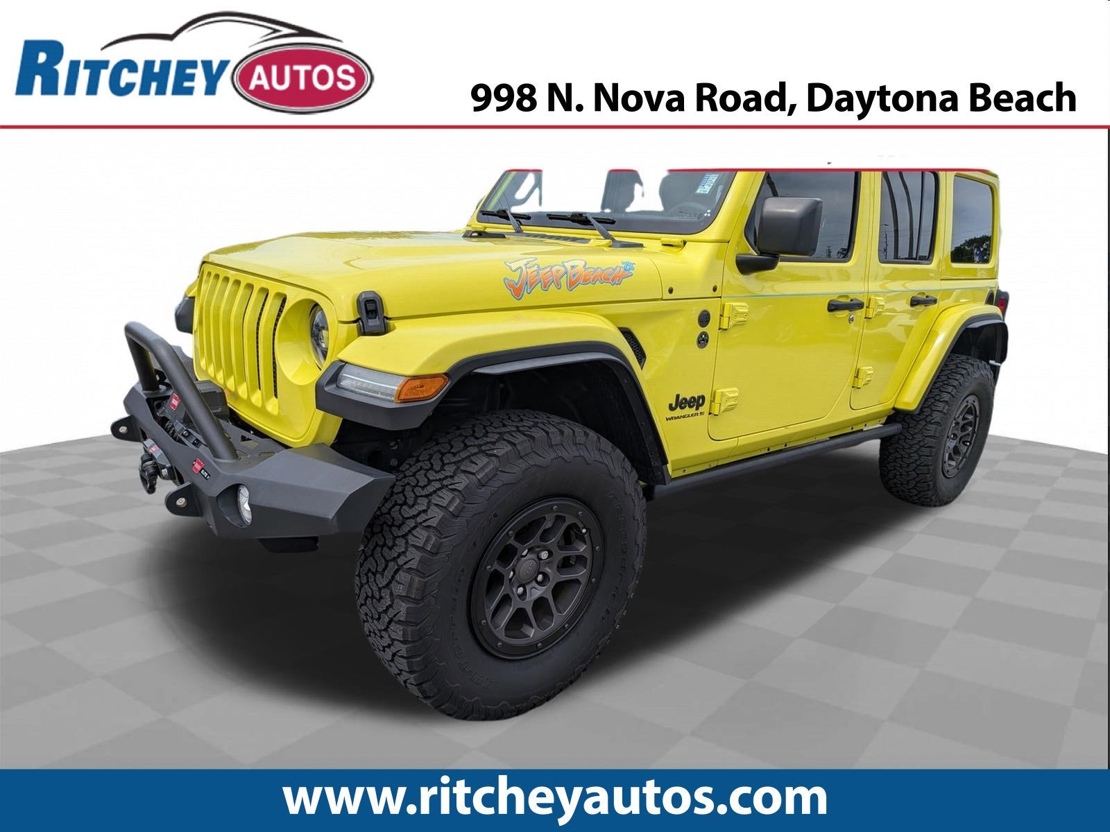 2023 Jeep Wrangler Sport in Yellow — front three-quarter view