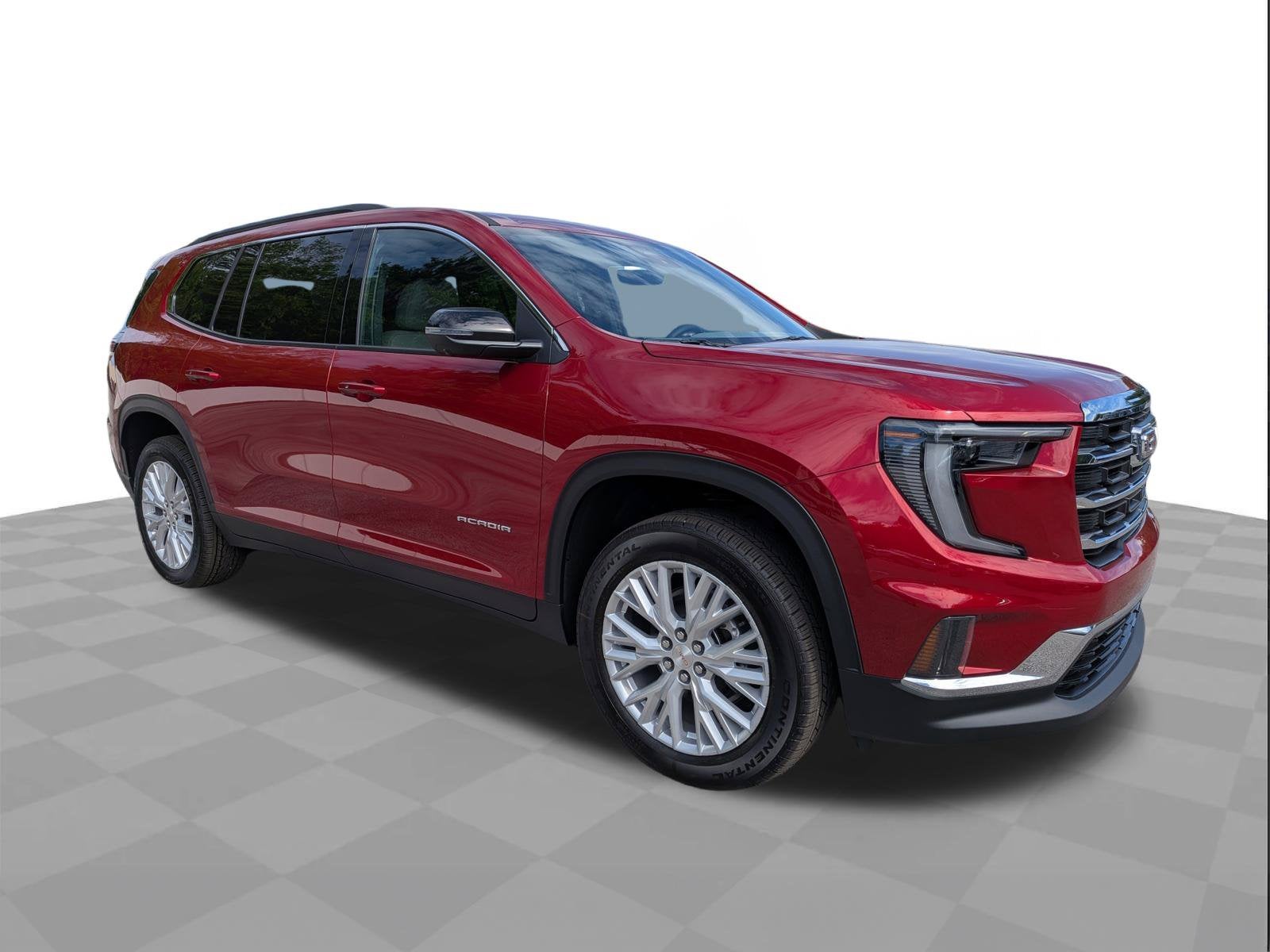 2026 GMC Acadia Elevation in Volcanic Red Tintcoat — front three-quarter view