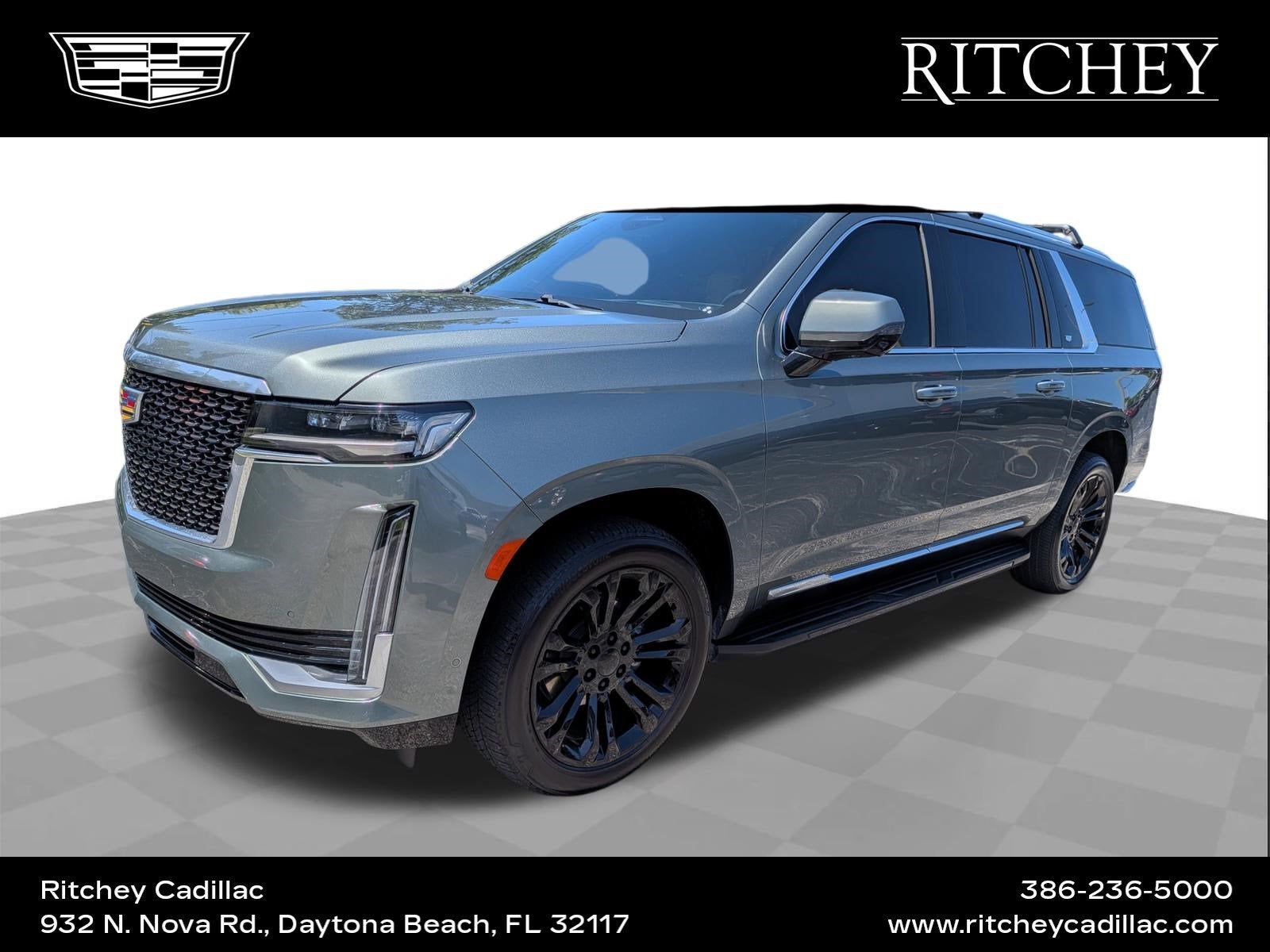 2024 Cadillac Escalade ESV Premium Luxury in Dark Emerald Metallic — front three-quarter view