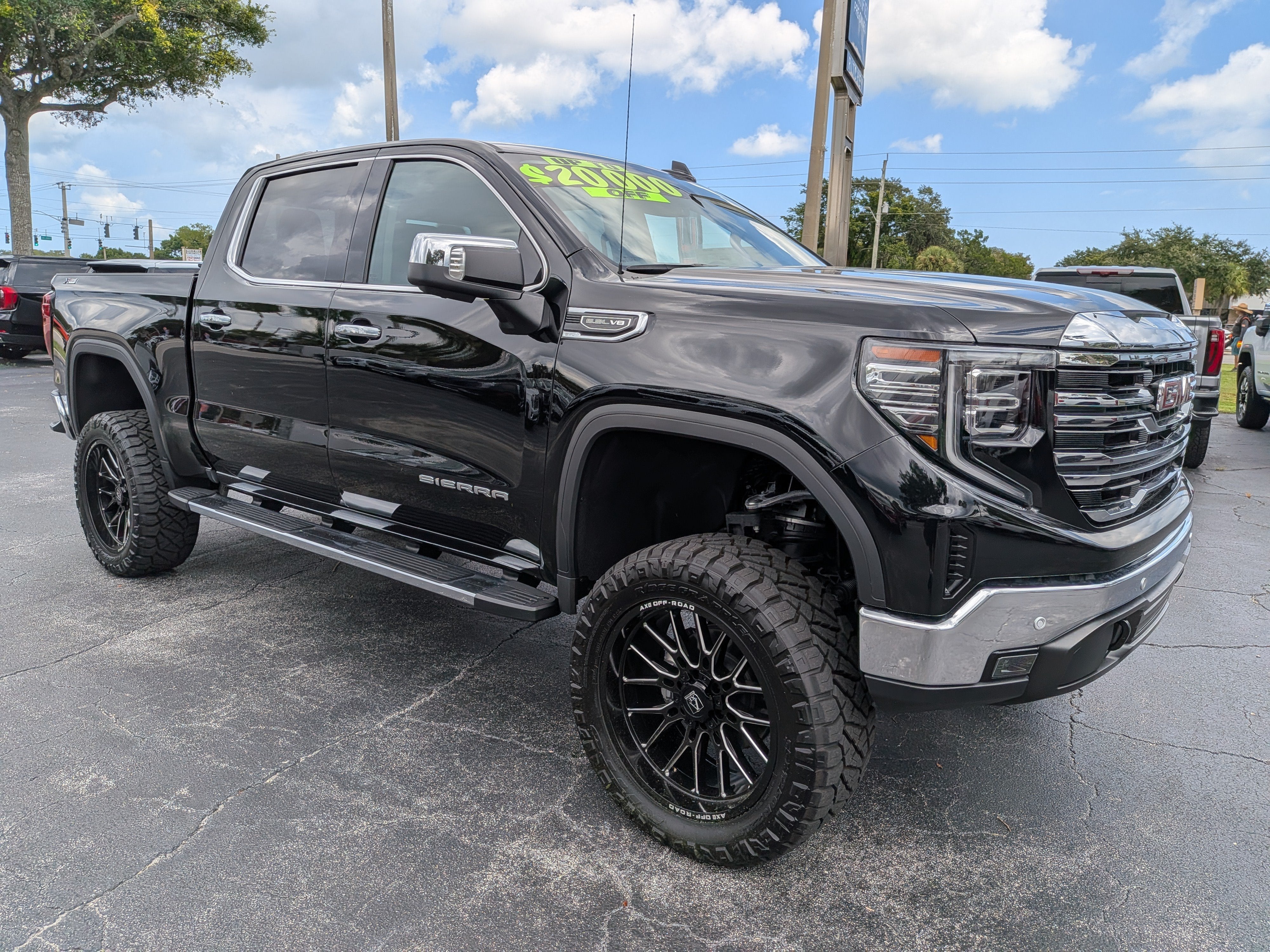 2026 GMC Sierra 1500 SLT in Onyx Black — front three-quarter view