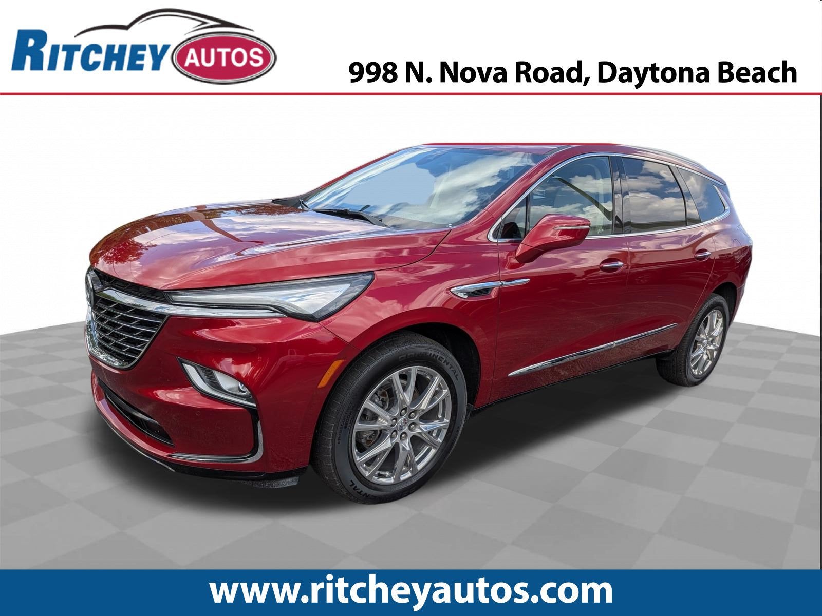 2023 Buick Enclave Essence in Cherry Red Tintcoat — front three-quarter view
