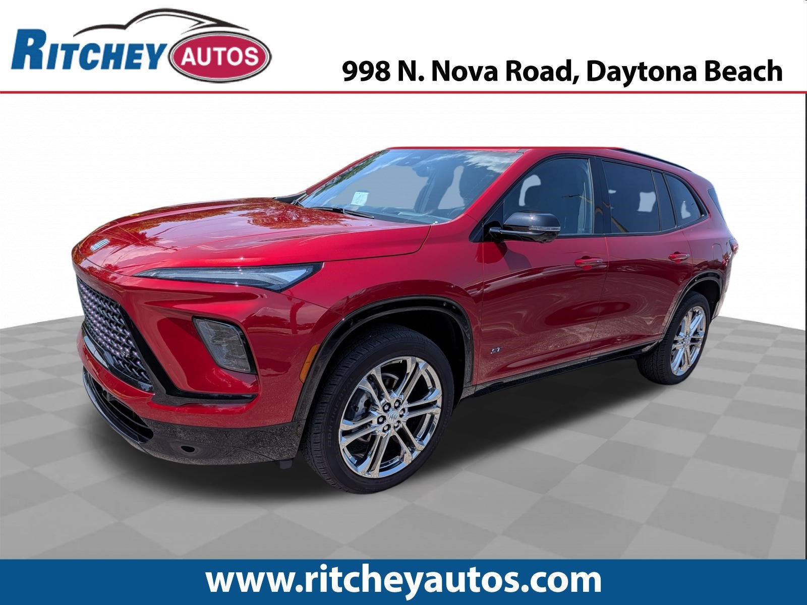 2025 Buick Enclave Sport Touring in Cherry Red Tintcoat — front three-quarter view